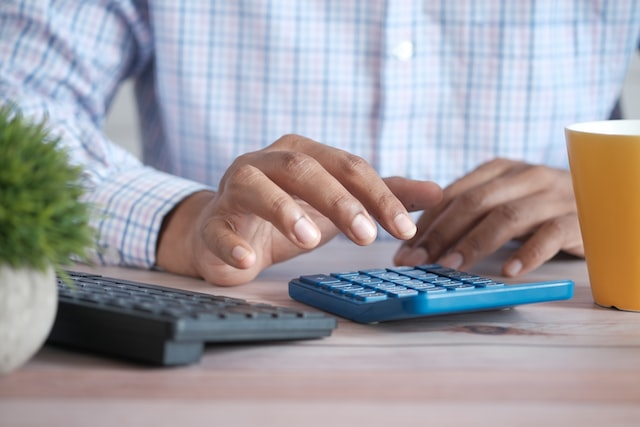 A professional accountant using a calculator